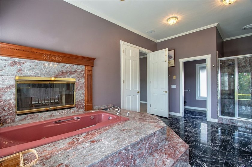 Positioned atop 20.22 fully fenced and gated acres, this stately - photo 33