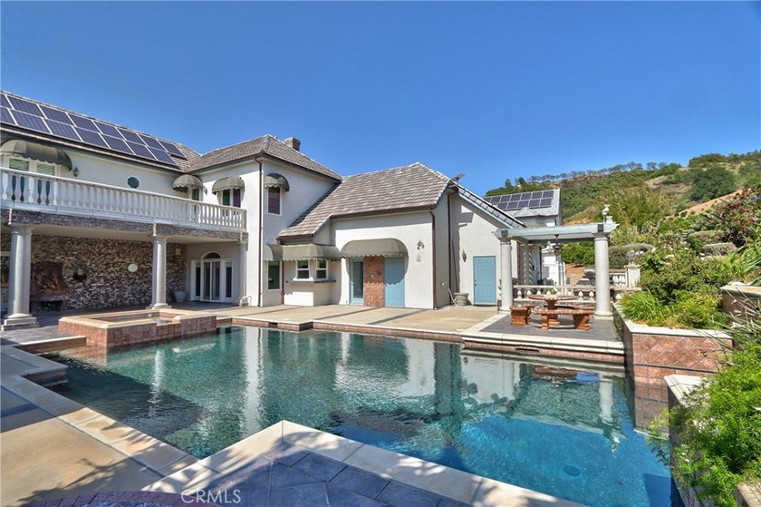 Positioned atop 20.22 fully fenced and gated acres, this stately - photo 47