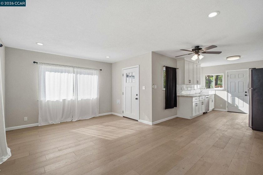 Step into an open-concept home where spacious rooms, ceiling - photo 11
