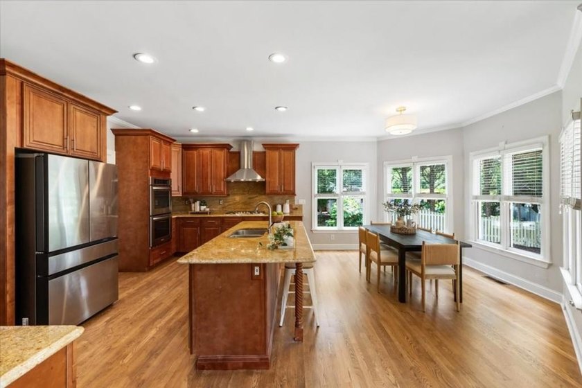 Welcome home to this stunning brick traditional nestled in the - photo 3