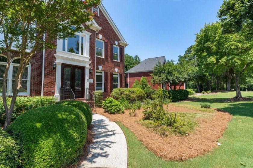 Welcome home to this stunning brick traditional nestled in the - photo 7