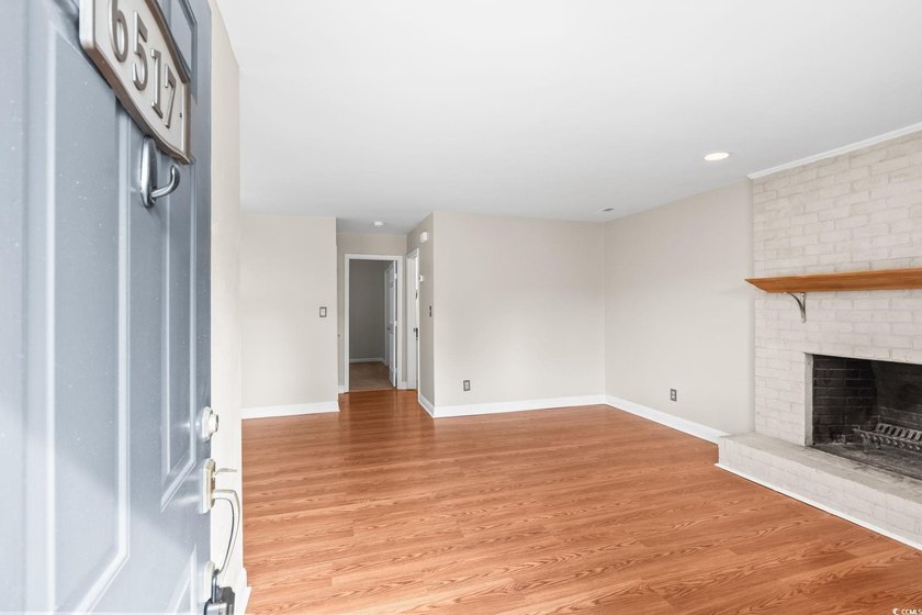 This charming three-bedroom, two-bathroom patio home is located - photo 2