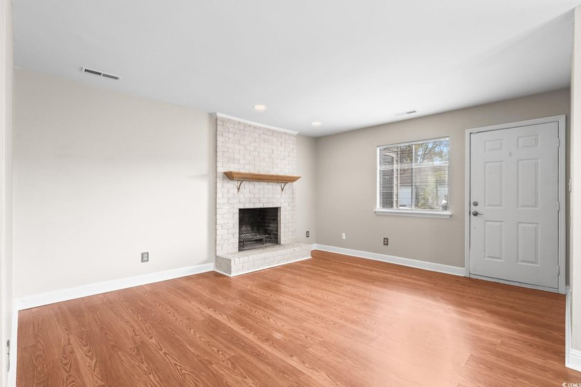 This charming three-bedroom, two-bathroom patio home is located - photo 3