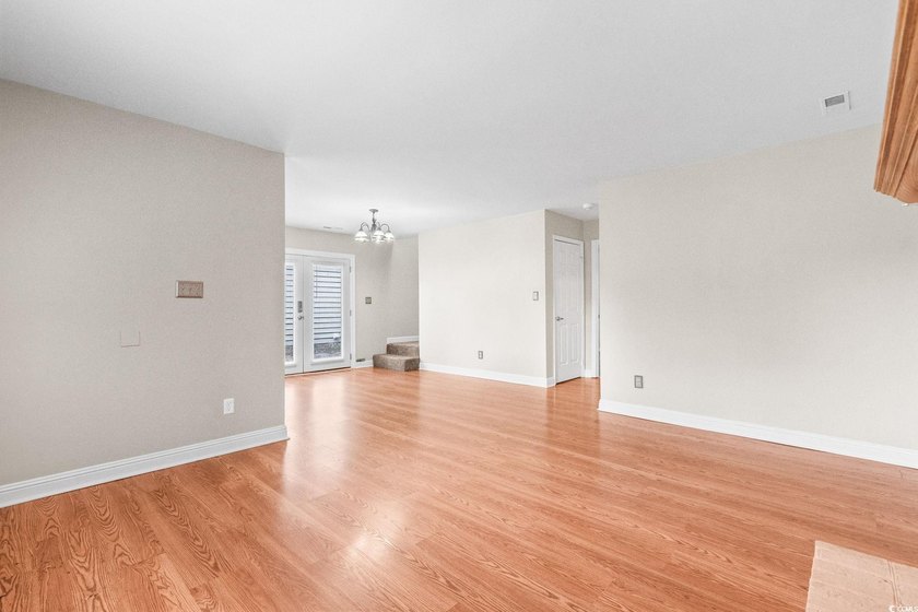 This charming three-bedroom, two-bathroom patio home is located - photo 5