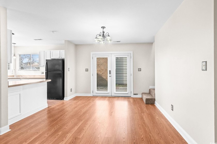 This charming three-bedroom, two-bathroom patio home is located - photo 7