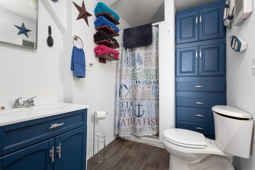 Escape to your own lakeside retreat with this charming 3-bedroom - photo 12