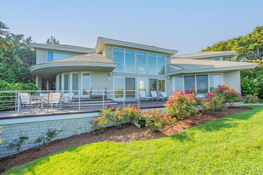 Set high on a scenic bluff in New Seabury, this contemporary - photo 8