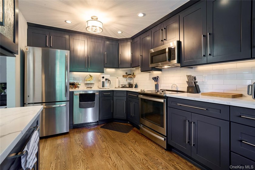 Welcome home to this bright and inviting remodeled 1st floor - photo 4