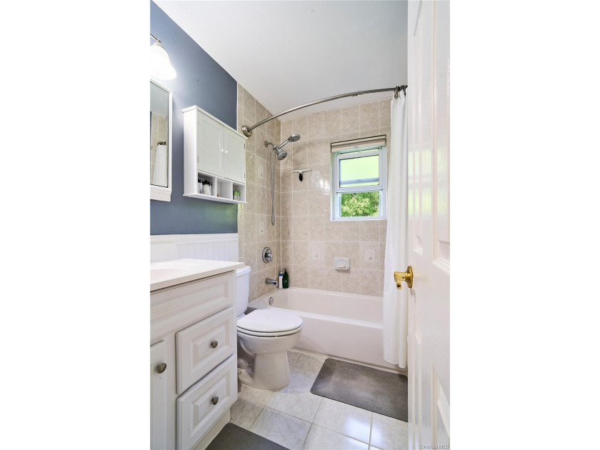 Welcome home to this bright and inviting remodeled 1st floor - photo 8