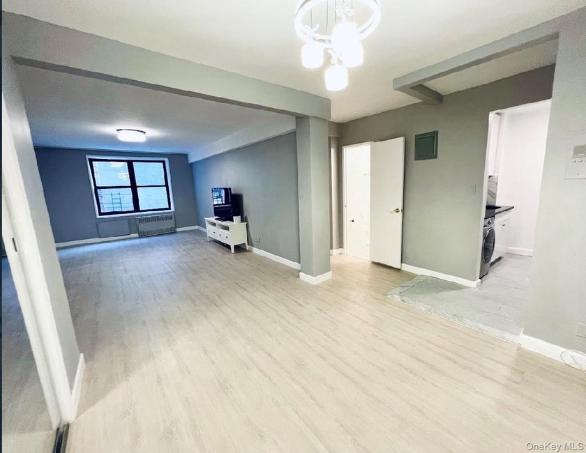 Spacious and bright high-floor 1-bedroom, 1-bath condo located - photo 3