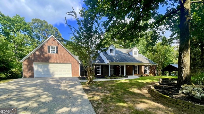 Welcome home to this stately 4-sided brick ranch tucked away on - photo 2