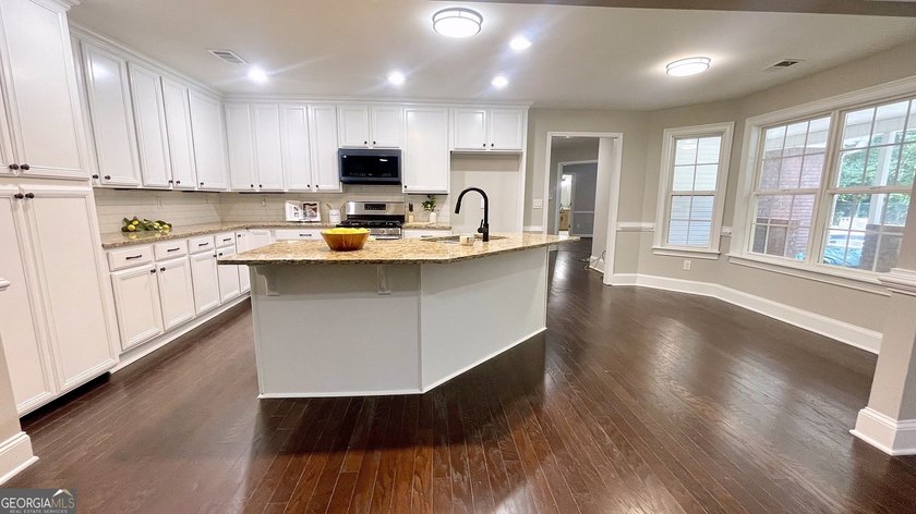Welcome home to this stately 4-sided brick ranch tucked away on - photo 7