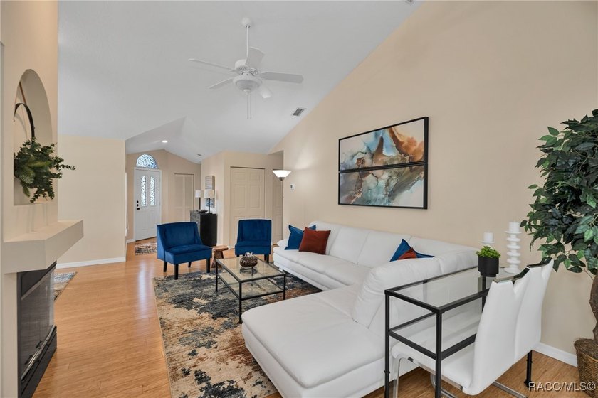 Enter to vaulted ceilings, beautiful bamboo floors in living and - photo 18