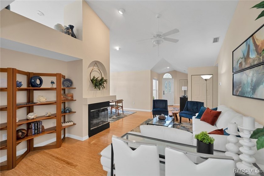 Enter to vaulted ceilings, beautiful bamboo floors in living and - photo 19