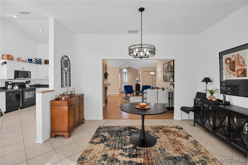 Enter to vaulted ceilings, beautiful bamboo floors in living and - photo 20