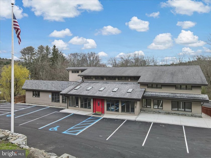With Parking lot expanded, repaved, and restriped, retaining - photo 3