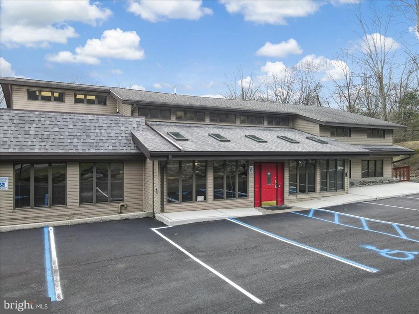 With Parking lot expanded, repaved, and restriped, retaining - photo 5