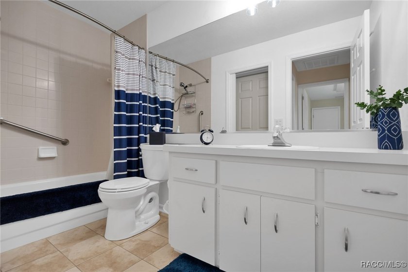 Enter to vaulted ceilings, beautiful bamboo floors in living and - photo 31