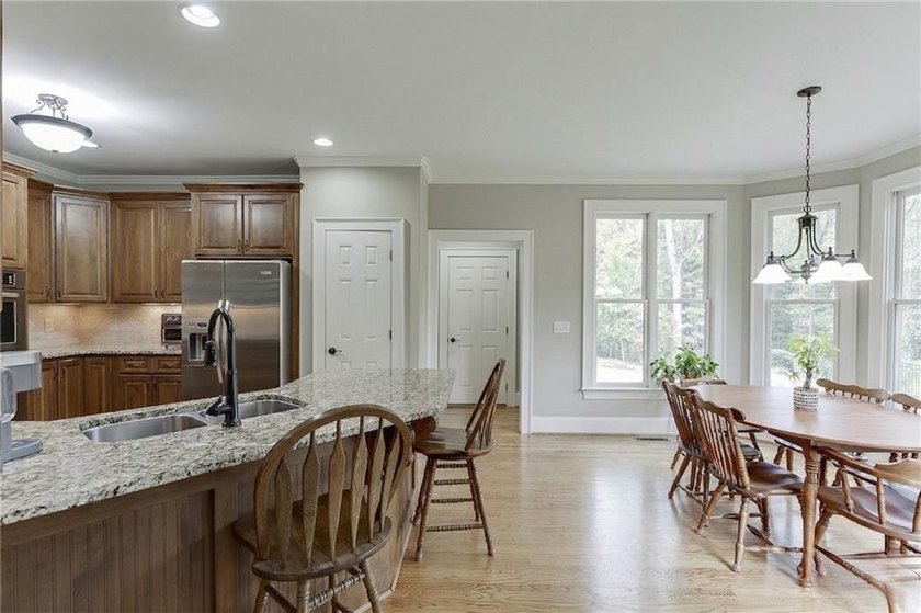 Nestled on a private one-acre homesite within the sought-after - photo 13
