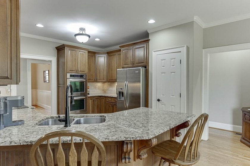 Nestled on a private one-acre homesite within the sought-after - photo 16