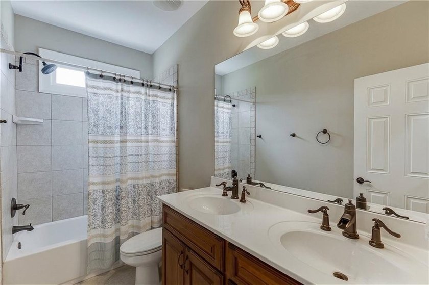 Nestled on a private one-acre homesite within the sought-after - photo 20