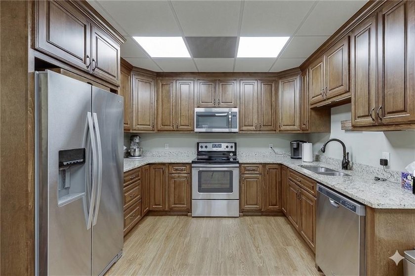 Nestled on a private one-acre homesite within the sought-after - photo 21