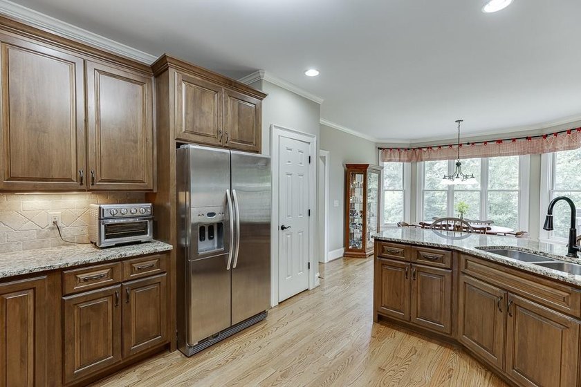 Nestled on a private one-acre homesite within the sought-after - photo 29