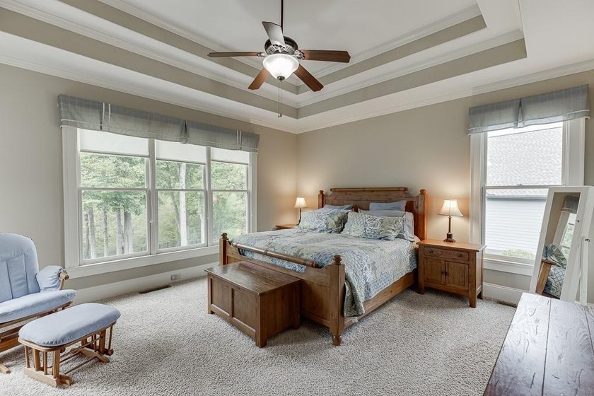 Nestled on a private one-acre homesite within the sought-after - photo 30