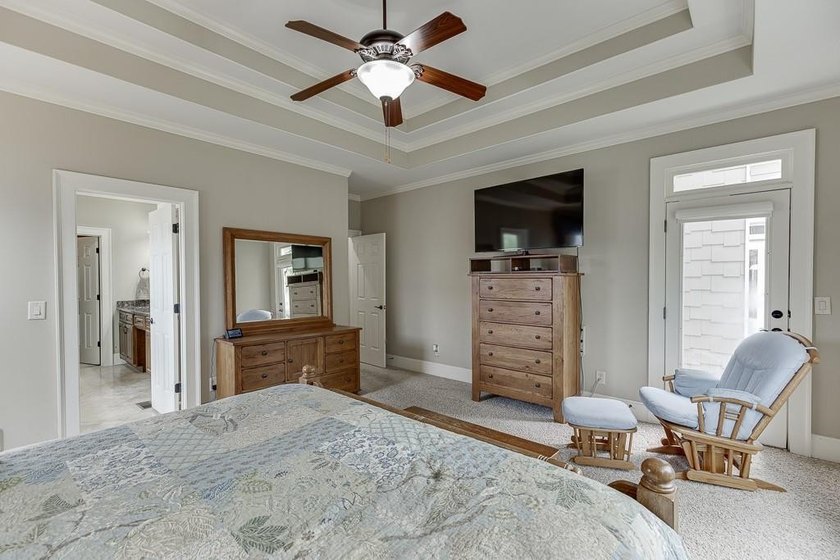 Nestled on a private one-acre homesite within the sought-after - photo 32