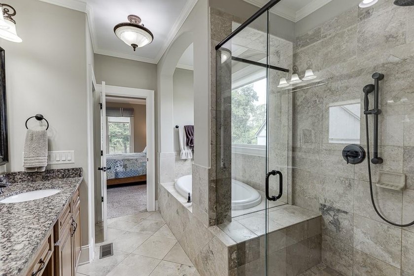 Nestled on a private one-acre homesite within the sought-after - photo 36