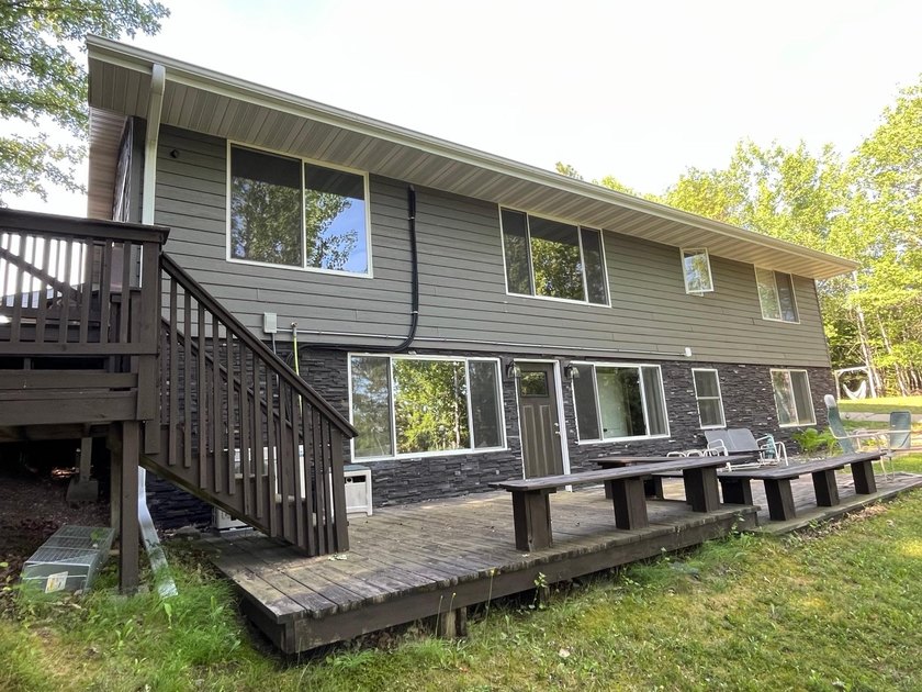 This spacious 5-bed, 3-bath walk-out home on Rainy River offers - photo 40