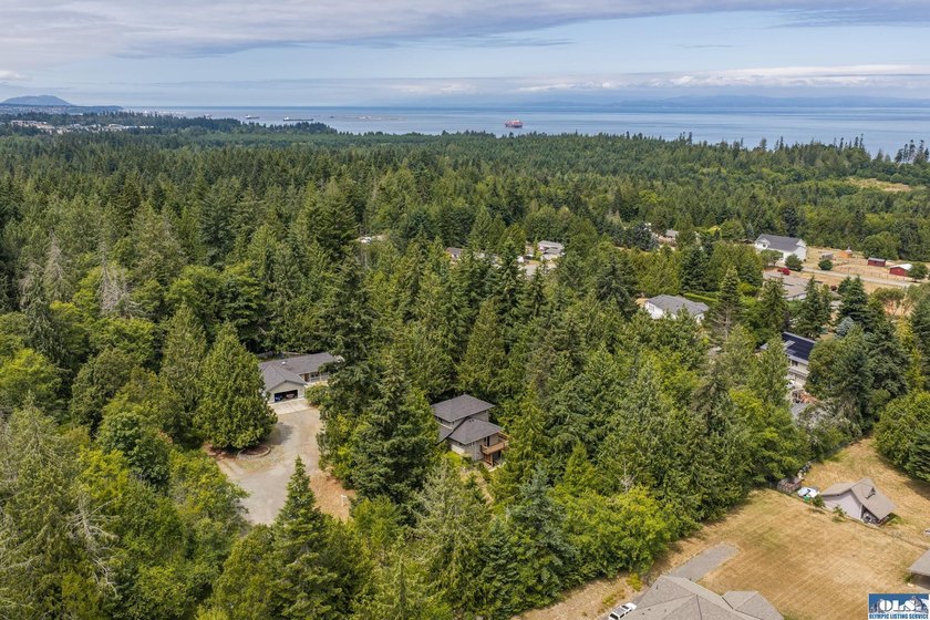 Amongst the trees on an acre this lovely 4 bed 2.5 bath home is - photo 2