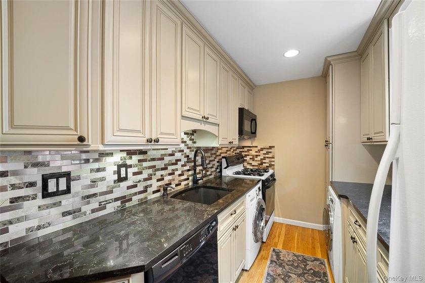 This desirable upper-level 2-bedroom cooperative in the - photo 3