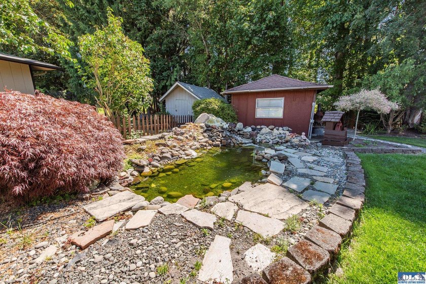 Nestled on a peaceful street in Sequim, this property backs - photo 4