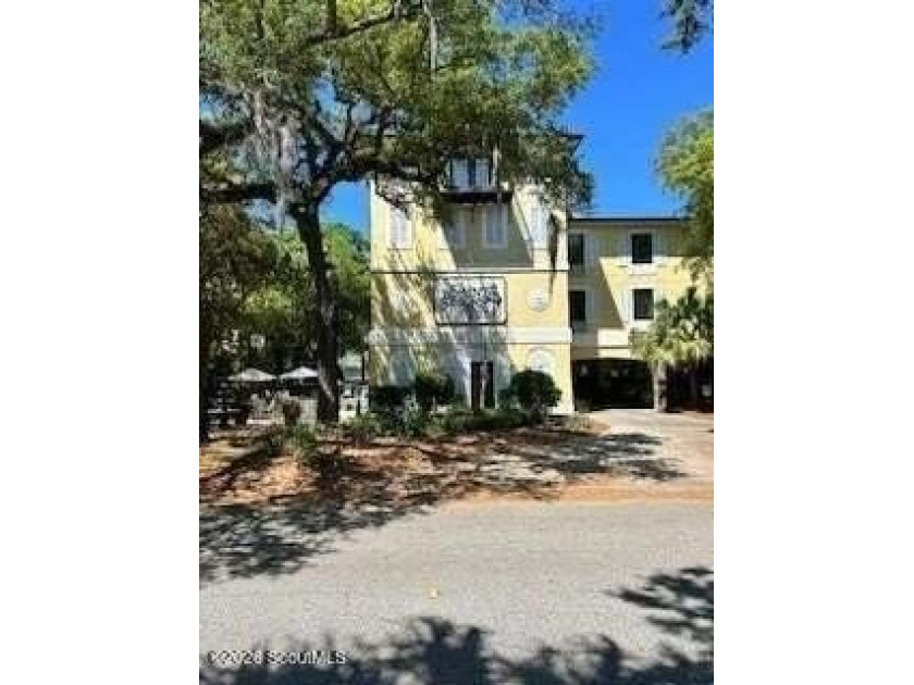 Discover the charm of Pier Village in this beautifully located - photo 2