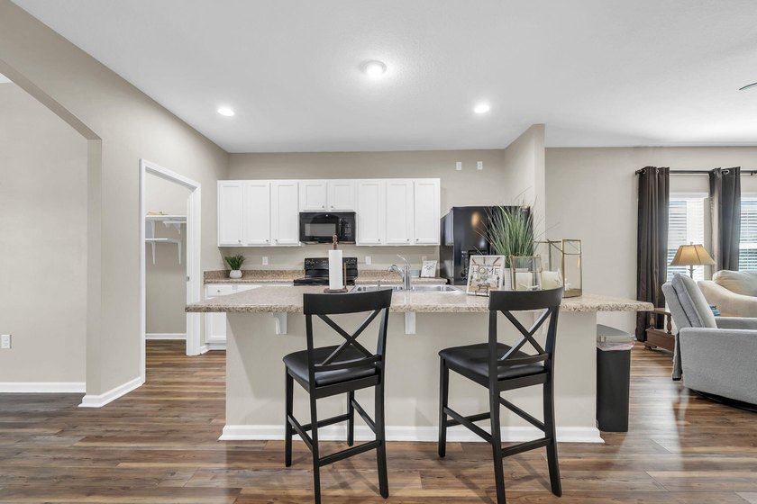 Located in Schooner Landing at Hammock Bay, this 3-bedroom - photo 3