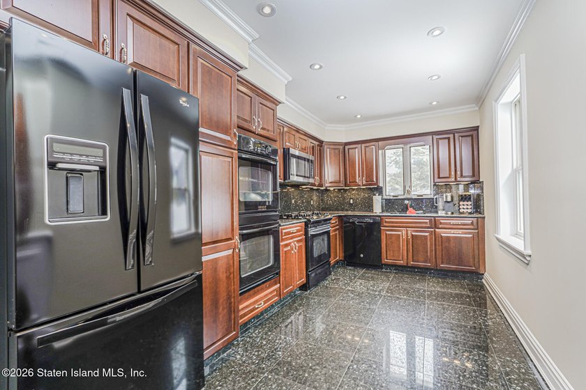 This beautifully updated home, expanded in 2007 to approximately - photo 4