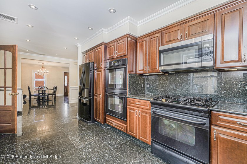 This beautifully updated home, expanded in 2007 to approximately - photo 6
