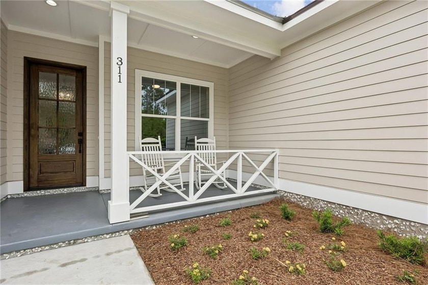 NEWLY COMPLETED AND BEAUTIFULLY DESIGNED, THIS 4-BEDROOM, 3-BATH - photo 9