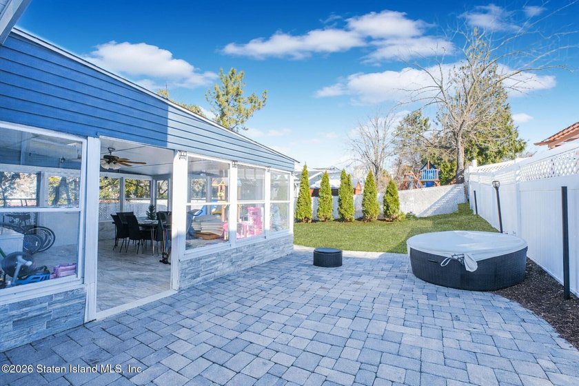 Welcome to 191 Suffolk Avenue, a warm and inviting two-family - photo 2