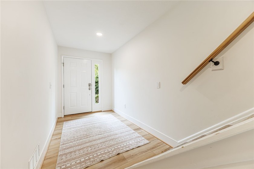 Wow! Incredible updates throughout! Tri-level living. Each of - photo 3