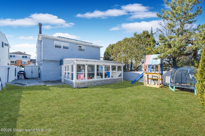 Welcome to 191 Suffolk Avenue, a warm and inviting two-family - photo 3