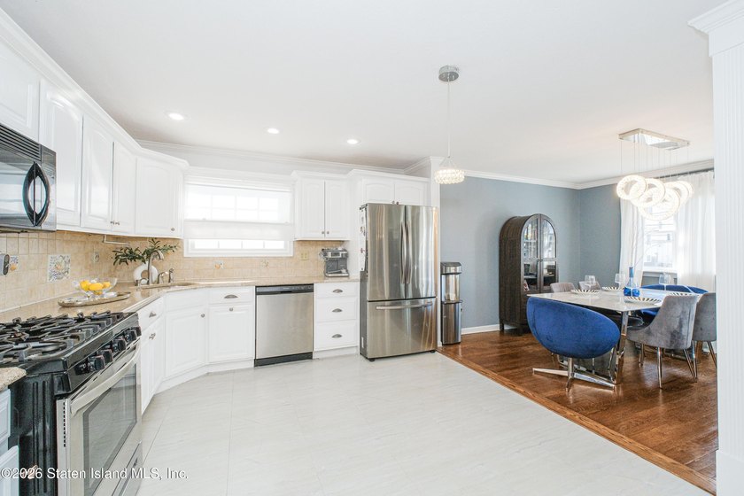 Welcome to 191 Suffolk Avenue, a warm and inviting two-family - photo 5