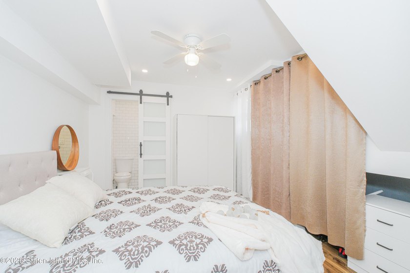 Welcome to 191 Suffolk Avenue, a warm and inviting two-family - photo 10