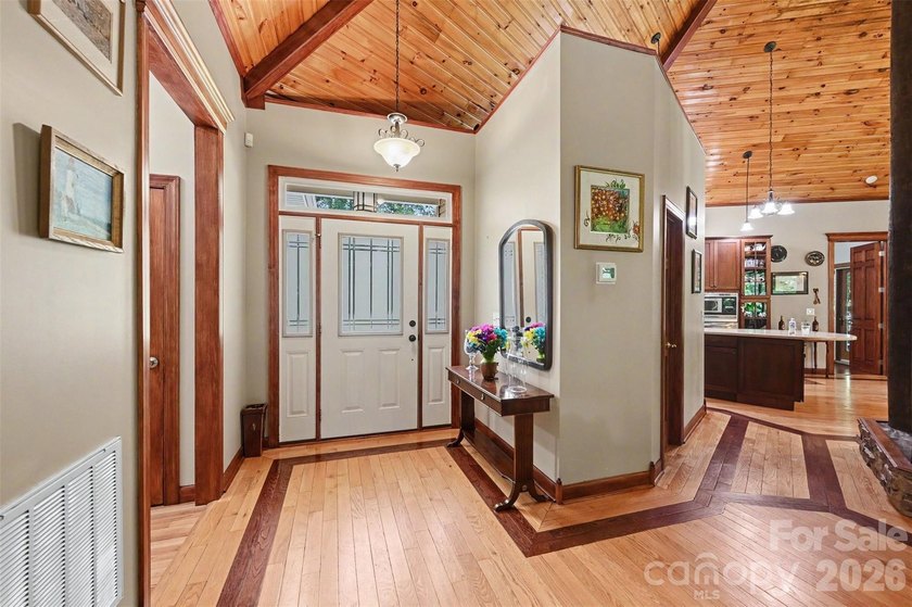 Tucked away on over 4 private wooded acres in the desirable - photo 5