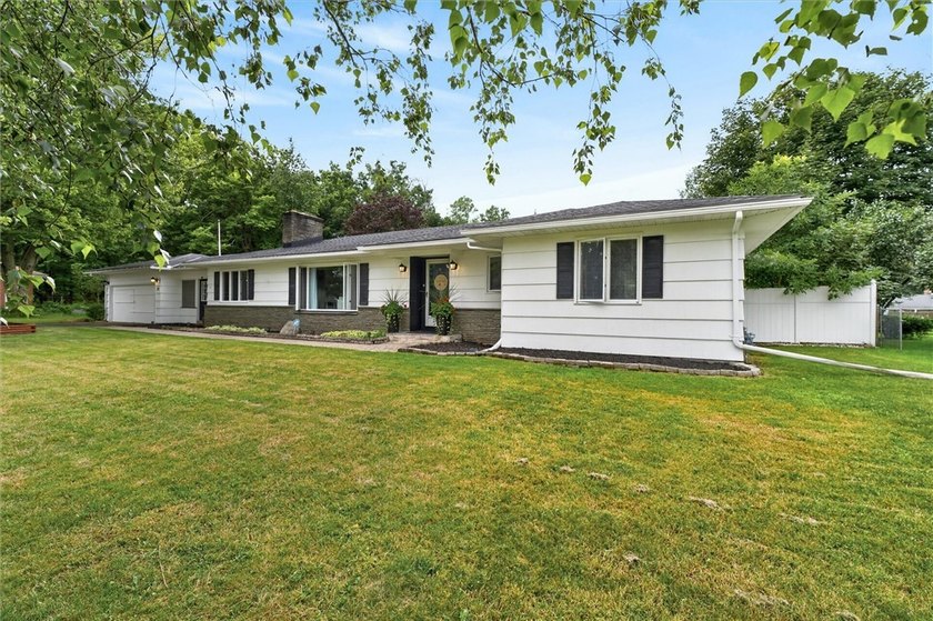 Welcome to 33 Greenbriar Dr in Gates. This Massive ranch is just - photo 2