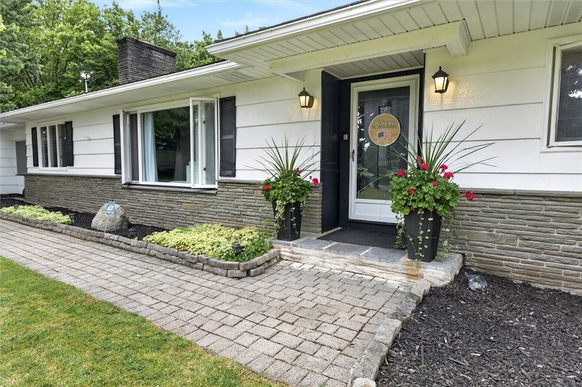 Welcome to 33 Greenbriar Dr in Gates. This Massive ranch is just - photo 3
