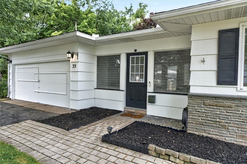 Welcome to 33 Greenbriar Dr in Gates. This Massive ranch is just - photo 4