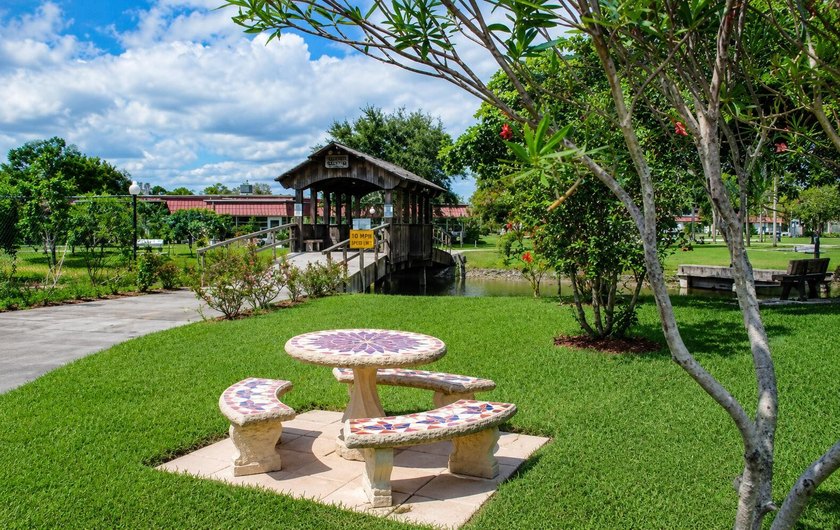 Welcome to this desirable 55+ community End-unit villa in the - photo 19