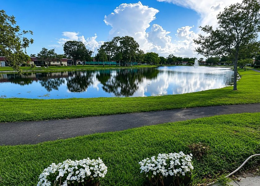 Welcome to this desirable 55+ community End-unit villa in the - photo 20